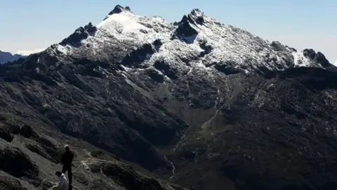 Reuters Tourists view Peak Humboldt in the Venezuelan Andes.