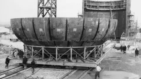 Historic England/John Laing Collection Cone shaped tower topper being moved