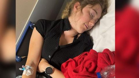 Rebecca Norman in hospital with a cannula in her arm
