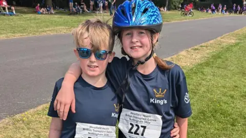 Wren with her arm around her brother Milo, both from Rutland, at the British Transplant Games in 2024 in Nottingham.