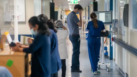 PA Media A general view of staff on a NHS hospital ward