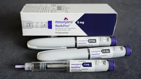 Collection of weight-loss jab paraphernalia and box, labelled "mounjaro kwikpen"