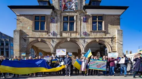 Terry-Harris.com A rally taking place outside Cathedral Square in Peterborough on Sunday 27 February