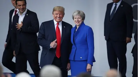 Getty Images Trump - May at NATO Summit