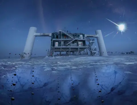 IceCube/NSF The IceCube facility, a structure built atop the ice in Antarctica. The picture is taken at nighttime, the moon a bright glow in the sky