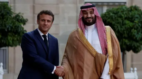 Reuters French President Emmanuel Macron welcomes Saudi Crown Prince Mohammed bin Salman for a working dinner at the Elysee Palace in Paris