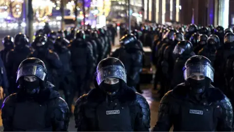 Mikhail Tereshchenko/Getty Images Riot police during an unauthorized rally in support of Alexei Navalny in central Moscow