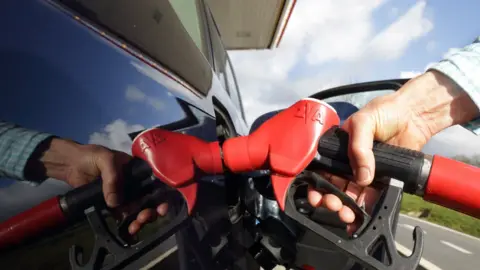 Getty Images Someone using a petrol pump