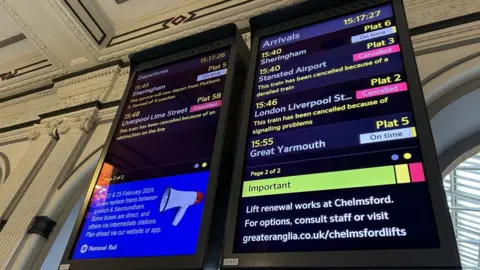 James Lanceley/BBC Station departure board showing cancelled trains