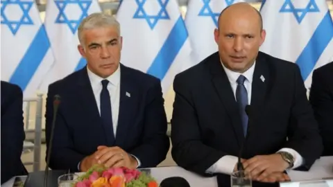 Reuters Yair Lapid (left) and Naftali Bennett (29/05/22)