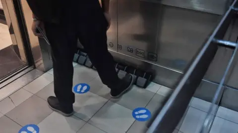 Getty Images A foot pedal in an elevator in Thailand