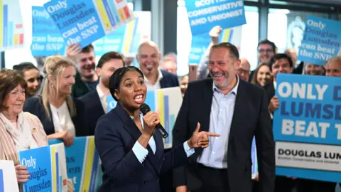PA Media Conservative Party leader Kemi Badenoch campaigning for Aberdeen South candidate Douglas Lumsden during a visit to Cove Rangers ahead of the by-election.