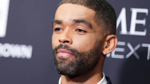 Getty Images Kingsley Ben-Adir pictured close up looking off to the left of the camera at a premiere.