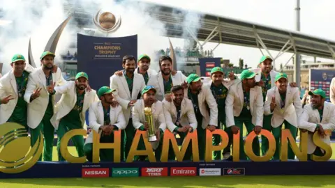 Pakistan celebrate with the trophy after winning the ICC Champions Trophy final.