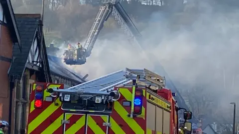 Carole Ann Powers Fire engine and aerial platform at house fire