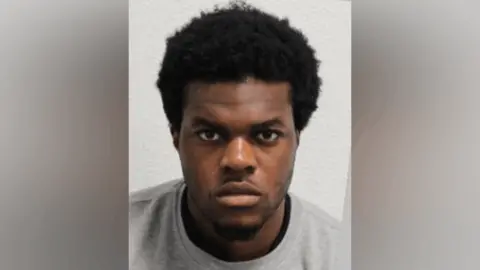 Met Police Custody image of Jackson Uwagboe in a grey t-shirt.