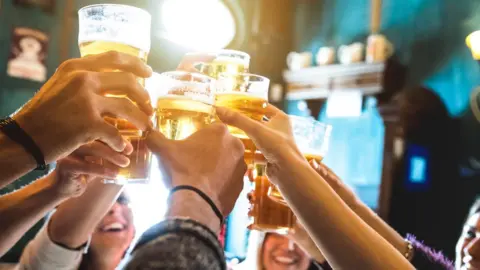 Getty Images Group of friends drinking alcohol