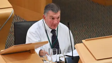 Getty Images Jeremy Balfour in parliament