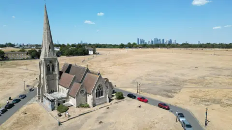 Getty Images All Saints Church with a view of London CBD in the backdrop.