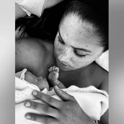Duchess of Sussex Meghan cradling newborn Lilibet