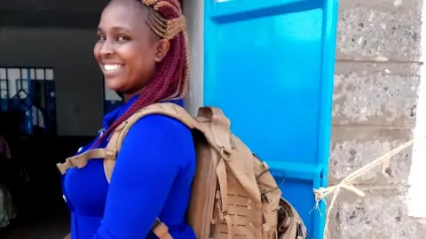 Monty Munford Midwife Margaret Wairimu Maina carries a technology-packed backpack