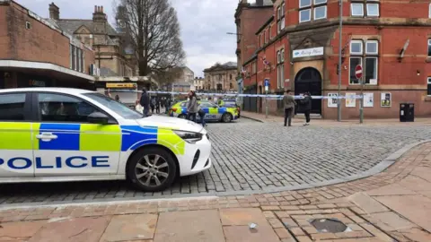 Richard Bates police cars at cordoned section in Darwen