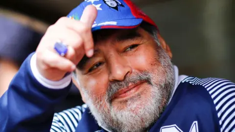 Getty Images  Diego Maradona smiling as head coach of  Gimnasia y Esgrima La Plata