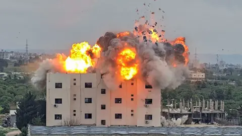 Kawnat Haju via Getty Images A fireball errupts from the site of an Israeli airstrike that targeted a building in the southern Lebanese village of Abbasiyyeh on March 13, 2026. 
