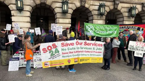 Demonstrators outside Monday's meeting