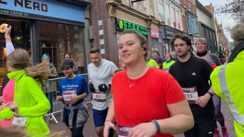 Runners heading through the city centre in 2023