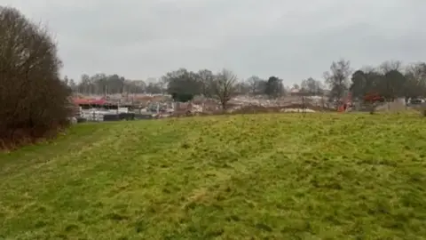A photo within undeveloped golf course land where 70 new homes could be built, with a view towards the Emmer Green Drive development site off Kidmore End Road, Caversham.