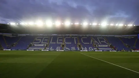 Getty Images A general view of the SCL Stadium in Reading ahead of a match against Northampton Town in October. It is dark outside and the stadium's floodlights are on.