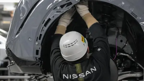 A worker in the Nissan Motor Tochigi plant, the company's largest in Japan, in Kaminokawa, Tochigi prefecture.