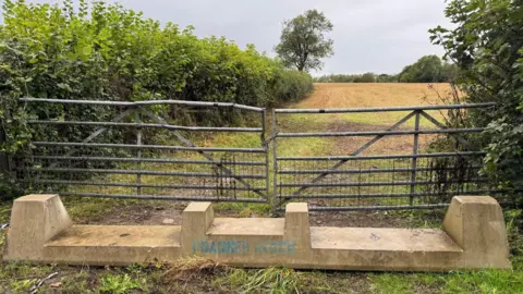 NFU Cymru A concrete barrier placed in front of damaged gates to a farmer's fields in the Vale of Glamorgan