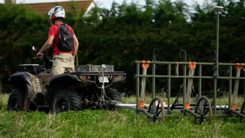 BBC Scientist on a quad bike with equipment attached