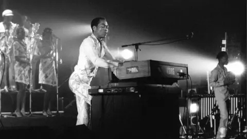 Getty Images Fela Kuti on stage playing keyboard