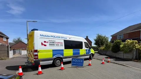 A police van in the middle of the road