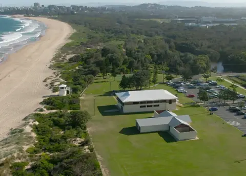 BBC/Andy Alcroft Fairy Meadow beach today - the open-air ladies' changing rooms, where Cheryl was last seen, are closest to the camera