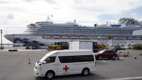 EPA Infected passengers are taken off the ship to be treated in hospitals