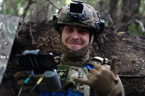 A smiling Ukrainian soldier