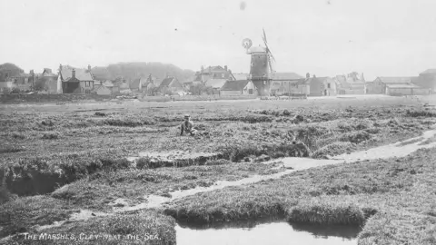 Norfolk Wildlife Trust A black and white photograph of the marshes at Cley next the Sea.