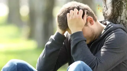 Getty A man with his head in his hands