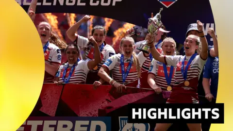 Wigan Warriors celebrate Challenge Cup victory with the trophy