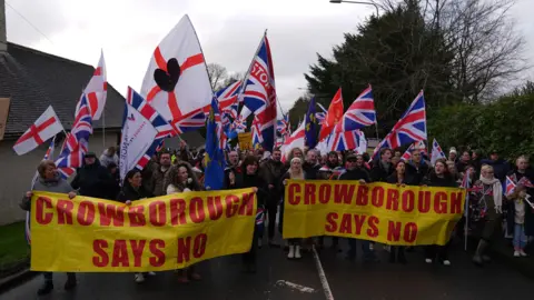 PA Media People take part in a protest in Crowborough