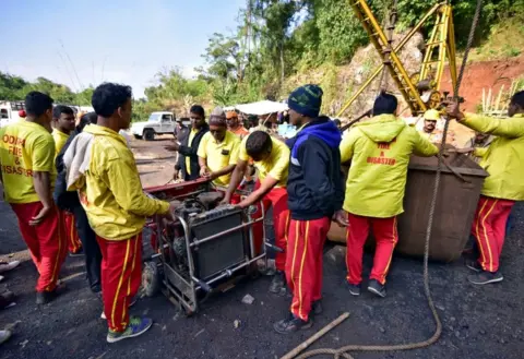 Reuters Rescuers prepare a water pump at the site of a coal mine that collapsed in Ksan
