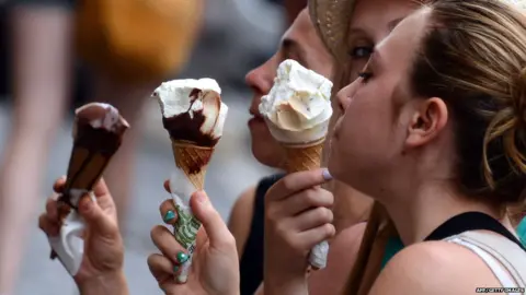 AFP/Getty Images People eating ice creams