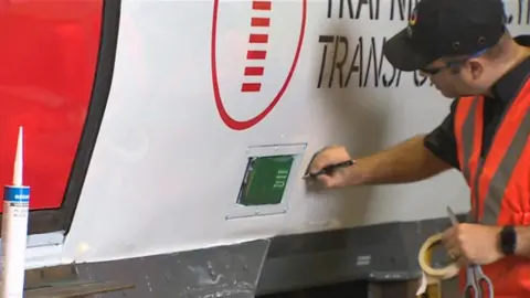 New branding on trains being applied