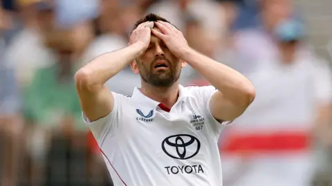 Mark Wood reacts during England's first Ashes Test in Perth