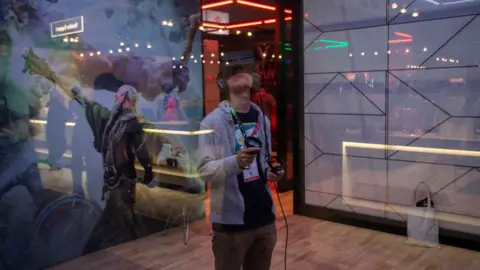 Getty Images A gamer plays in the Oculus exhibit at E3 2019