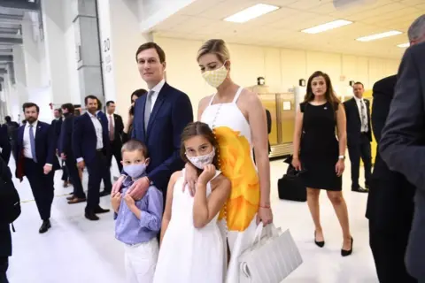 Getty Images An unmasked Jared Kushner alongside a masked Ivanka Trump and their kids during a public appearance